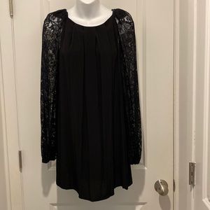 Black dress. Sleeves are sheer lace